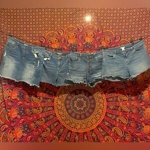 Three pairs of jeans shorts (sizes 12, 12 & 11) and one Jean skirt (size 12)
